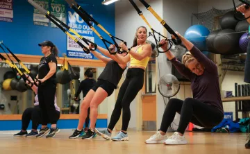 Karen and her class performing squats