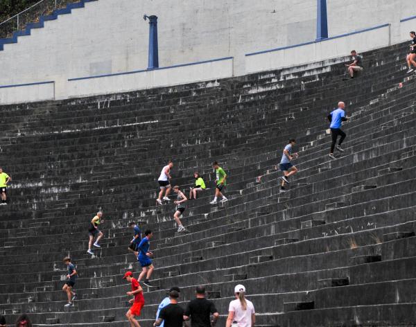 Unleashed participants run the steps at the Stadium High School football field