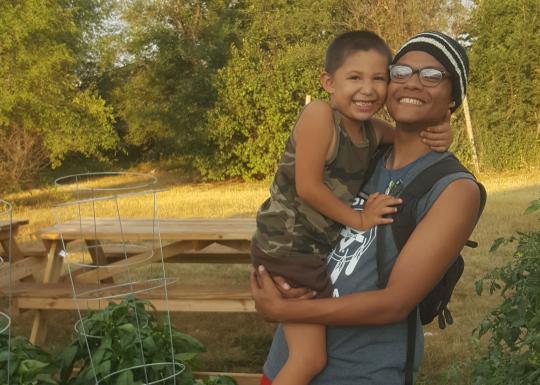 Smiling WiIth Child At YMCA Summer of Service