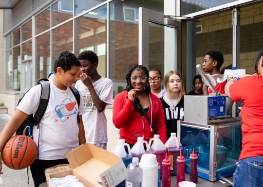 Late nite participants queue up for snow cones at the YMCA