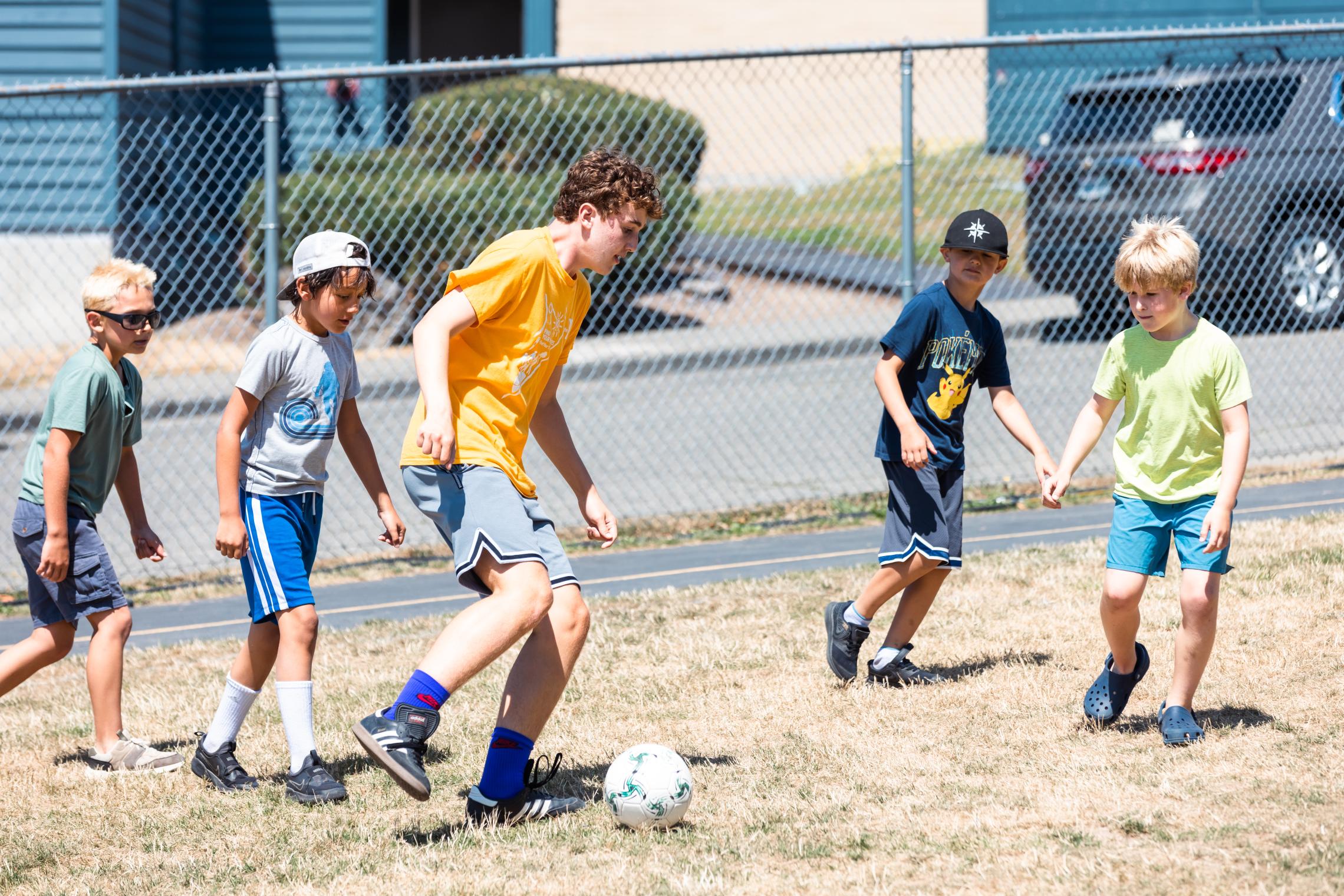CIT plays soccer with campers at the YMCA