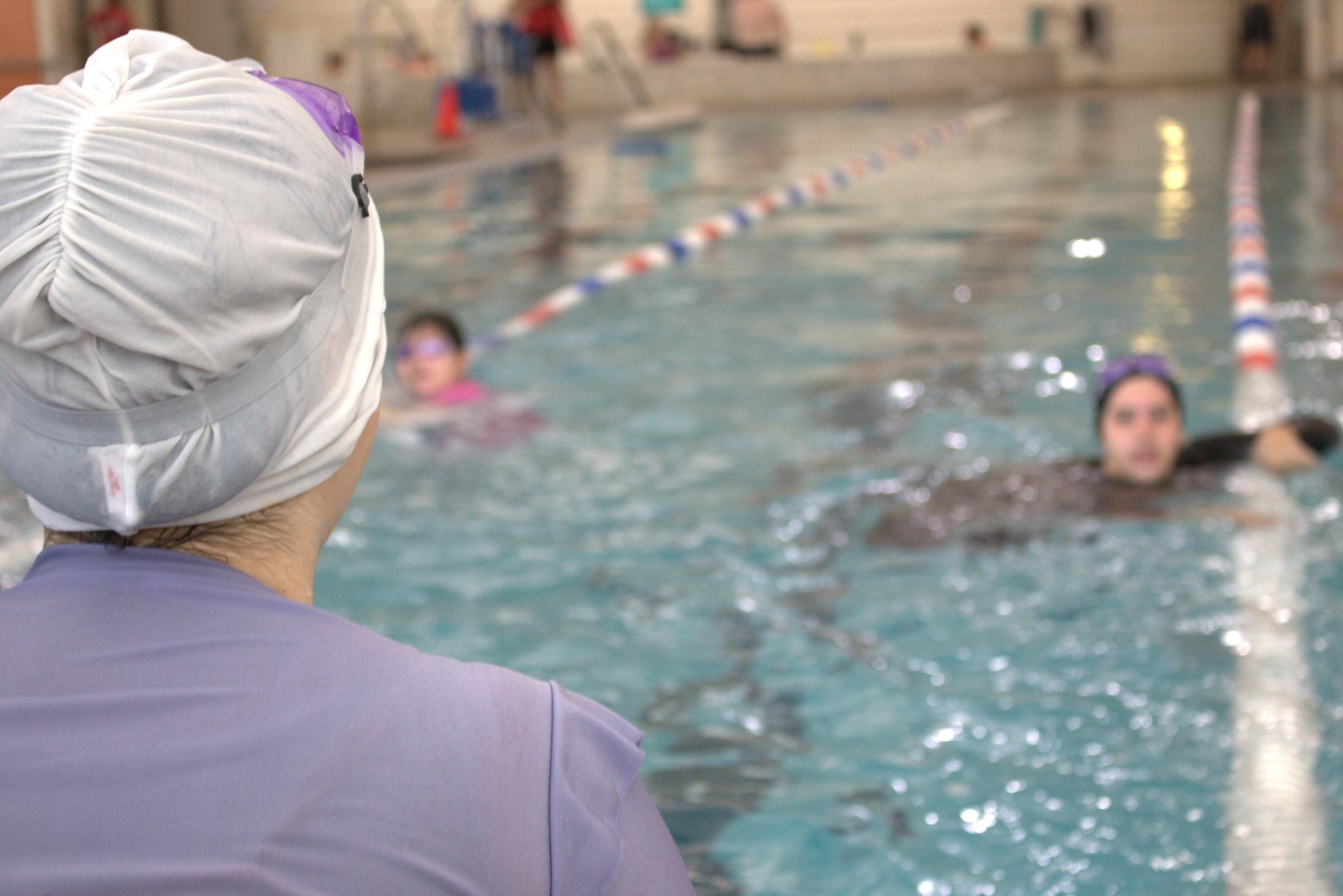 Shot of a lap swimmer looking over a couple of lap lanes during open swim at the YMCA