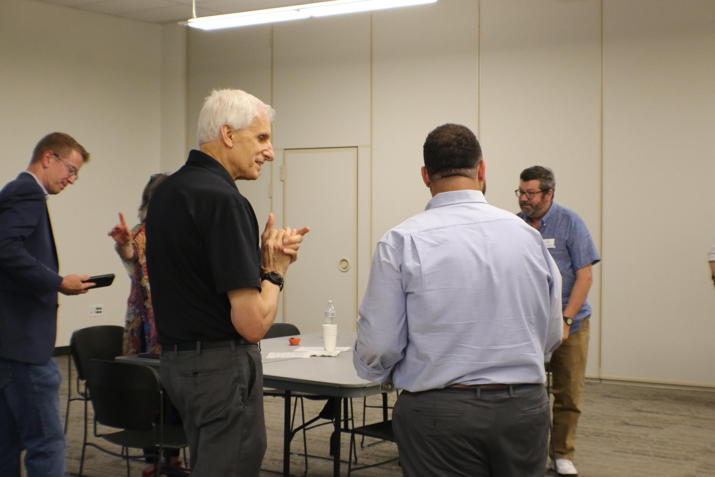 YMCA CEO, Charlie Davis engages in dialogue with other Bridge of Hope members