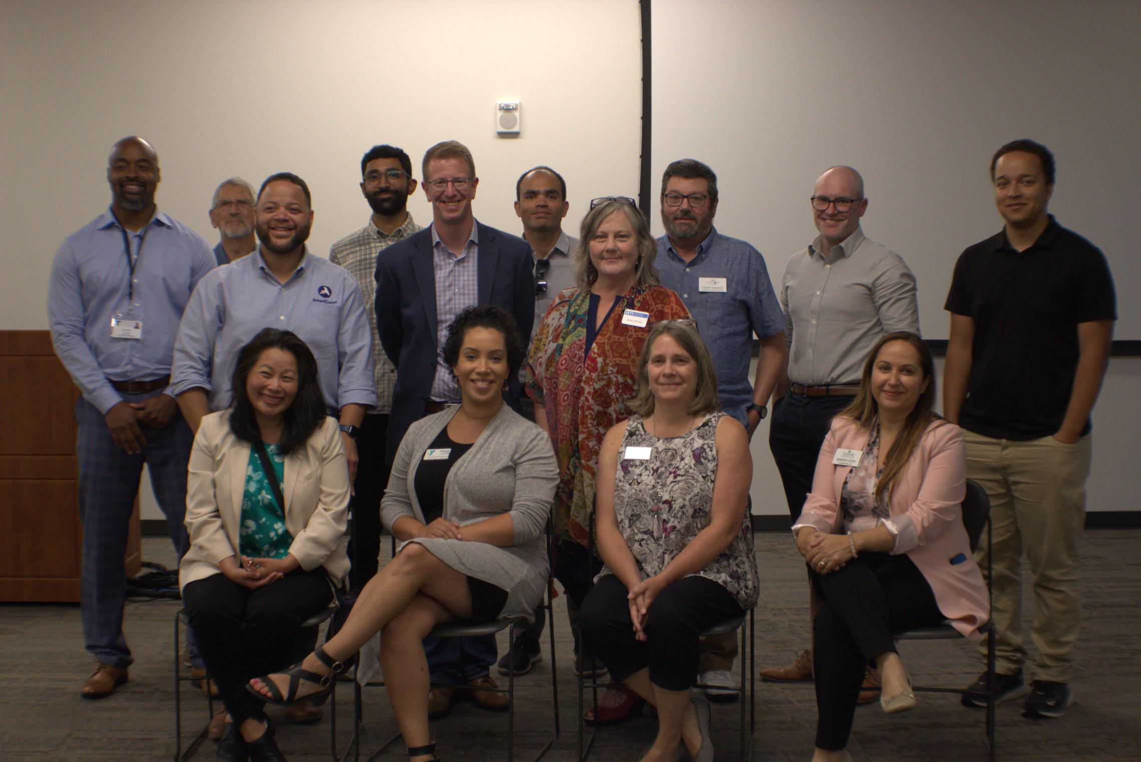 Bridge of Hope participants pose for a photo after the conclusion of their structured dialogue at the YMCA