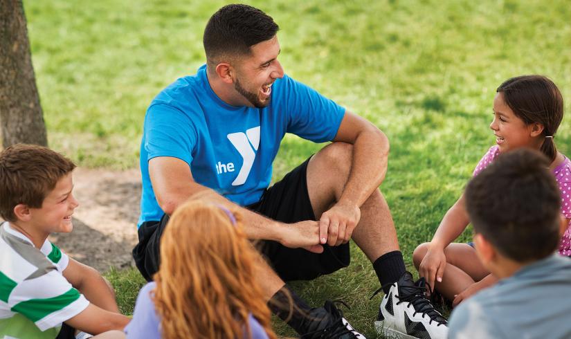 YMCA Summer Camp Volunteer Talking with Kids