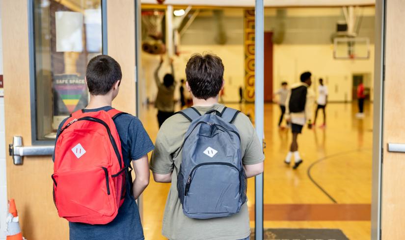 Late nite students enter the doorway of the main gym at the YMCA