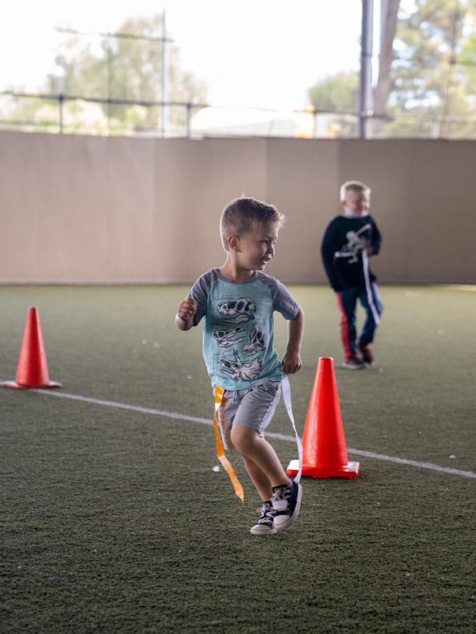 Happy children playing flag football