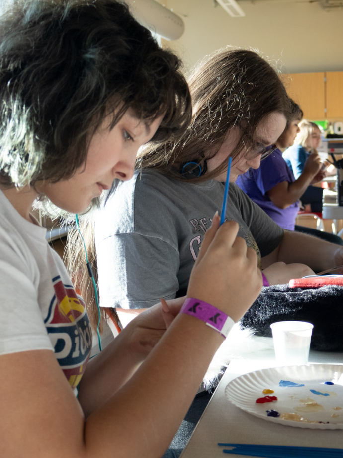 YLDC students work on a painting project at the YMCA