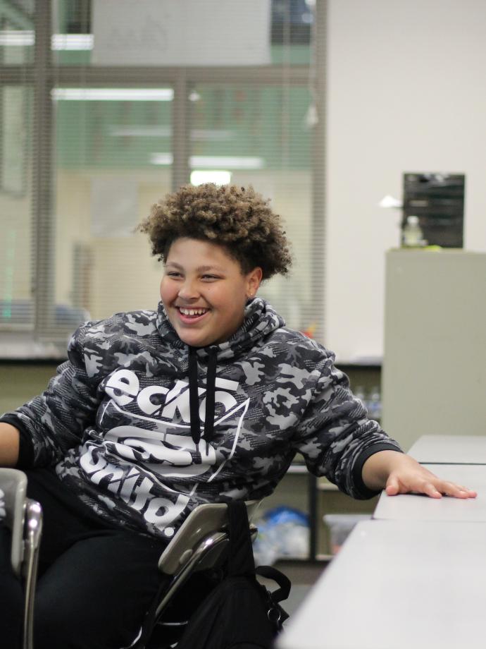 CCI student smiling in the middle of a lesson at the YMCA