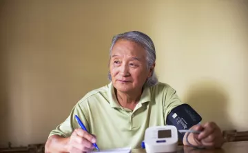 Active older adult self-monitoring their blood pressure