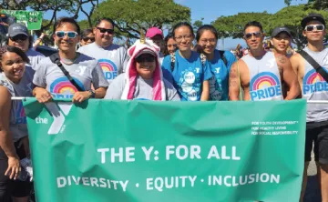 A group of YMCA members and staff celebrates Pride in Pierce County