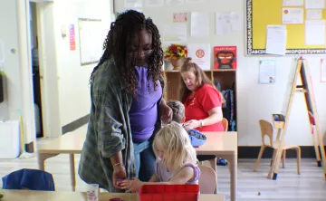 Day Harvey and YMCA staff leading a lesson plan