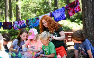 Action shot of a tie-dye session at a YMCA camp